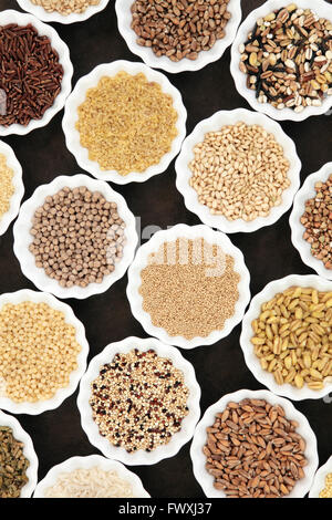 Cereal and grain food selection in porcelain crinkle bowls. Stock Photo