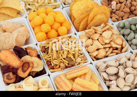 Savory snack party food selection in square porcelain bowls. Stock Photo