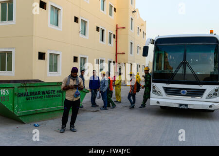 QATAR, Doha, industrial complex, housing camp for foreign migrant worker outside the city, the contract worker work on construction sites for the FIFA soccer World Cup 2022, bus transfer from work to camp Stock Photo