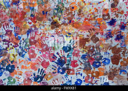 Children's hand prints on a plywood wall in Brooklyn, New York. Stock Photo