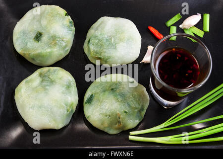 Allium tuberosum. Garlic chives with soy source. Dim-sum is chinese cuisine. Dim-sum. Flat Lay in Food. Stock Photo