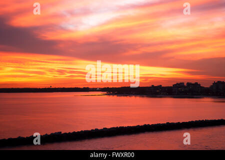 The dark red sunset view with Miami coastline in a background (Florida). Stock Photo