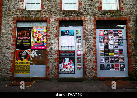 Posters on doors of stone building in Womanby Street, Cardiff, South Glamorgan, Wales, United Kingdom Stock Photo