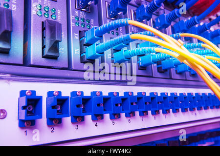 Fiber optic connecting on core network swtich Stock Photo