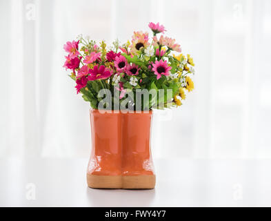 decorations for the garden. boots with flowers Stock Photo