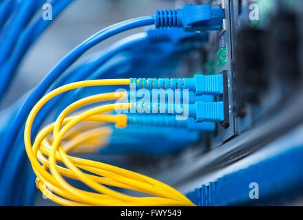Fiber optic connecting on core network swtich Stock Photo