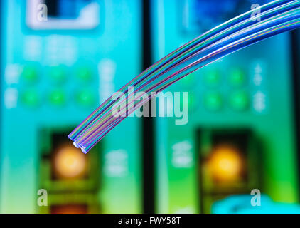 optical fibres dinamic flying from deep on technology background Stock Photo