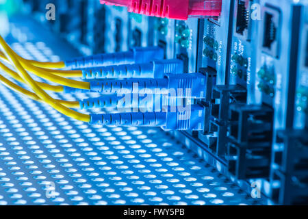 Fiber optic connecting on core network swtich Stock Photo