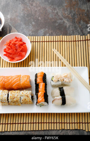 salmon and fish rolls on plate Stock Photo