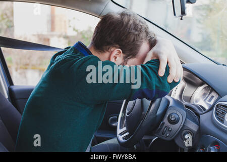 tired driver in the car Stock Photo