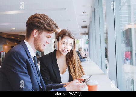 business people chatting in cafe at lunch or coffee break Stock Photo