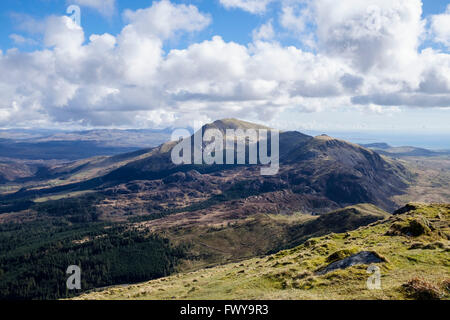 View south across rocky upland to Moel Hebog from Mynydd Drws-y-Coed on Nantlle Ridge in mountains of Snowdonia National Park. G Stock Photo