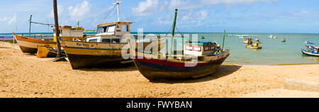 Fishing boat  on sand beach in Praia do Forte, Bahia, Brazil Stock Photo