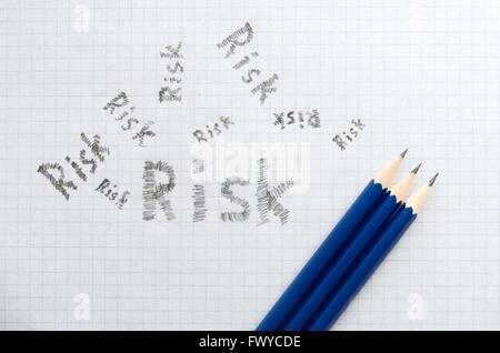 Square paper with pencils as risk business concept. Stock Photo