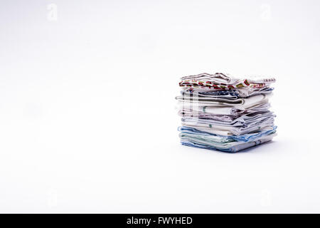 a stack of folded handkerchiefs on white background Stock Photo