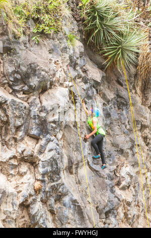 Banos, Ecuador - 30 November 2014: Basalt Challenge Of Tungurahua, Exercise Climbing Rescue, Demonstration Of A Sports Girl Stock Photo