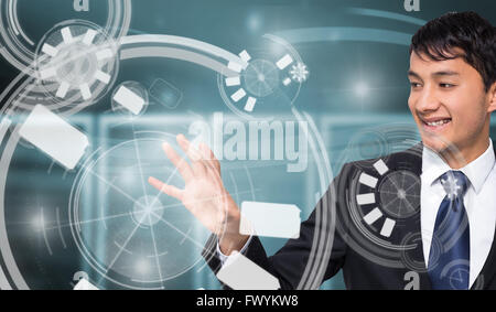 Composite image of smiling businessman touching Stock Photo