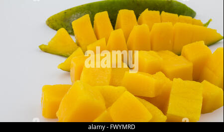 Close up of mango pieces isolated on white Stock Photo