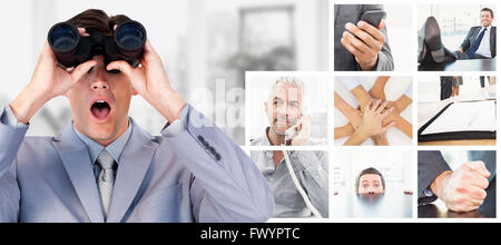 Composite image of suprised businessman looking through binoculars Stock Photo