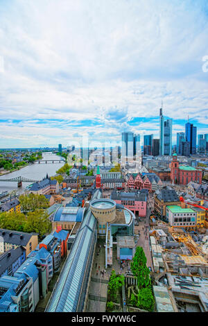 Panoramic view of Frankfurt skyline and Romerberg City Hall Square in Frankfurt in Germany. The Romerberg consists of old houses. Tourists nearby Stock Photo