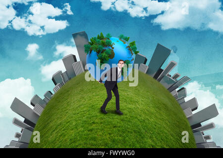 Businessman carrying the world Stock Photo