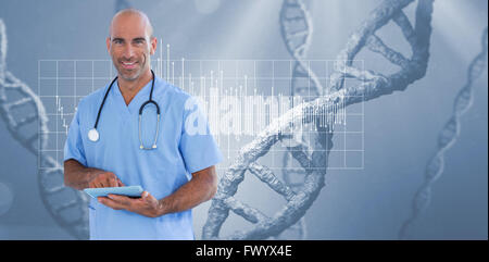 Smiling doctor using tablet computer Stock Photo