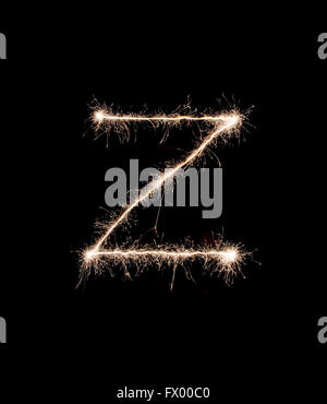 Letter Z drew with spakrs on a black background. Stock Photo