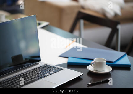 Office workplace with laptop and office supplies Stock Photo