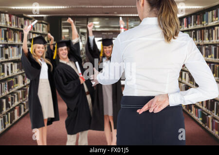 Composite image of businesswoman offering handshake with fingers crossed behind her back Stock Photo