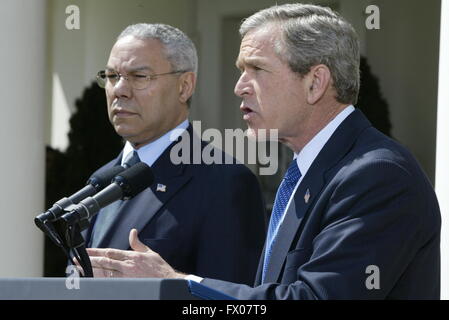 Washington, District of Columbia, USA. 4th Apr, 2002. United States President George W. Bush makes an announcement in concerning his Middle East policy in the Rose Garden of the White House in Washington, DC on April 4, 2002 as US Secretary of State Colin Powell looks on.Credit: Ron Sachs/CNP © Ron Sachs/CNP/ZUMA Wire/Alamy Live News Stock Photo