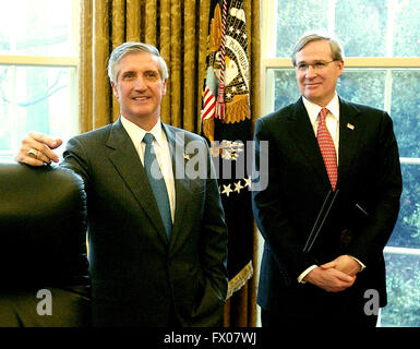 Washington, District of Columbia, USA. 13th Jan, 2006. Washington, DC - January 13, 2006 -- White House Chief of Staff Andy Card, left, and National Security Advisor Steve Hadley, right, look on as United States President George W. Bush makes remarks to the press after meeting with three business leaders to discuss raising money privately for those affected by the storms and natural disaster in Guatemala and Honduras. Credit: Ron Sachs/Pool © Ron Sachs/CNP/ZUMA Wire/Alamy Live News Stock Photo