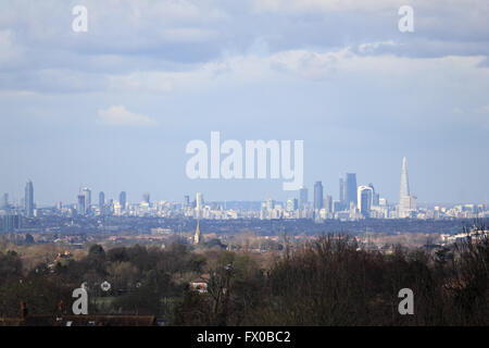 Epsom Downs, Surrey, England, UK. 9th April 2016.  When the sun came out on a day of sunshine and showers at Epsom Downs, Surrey, the London skyline was lit up. Credit:  Julia Gavin UK/Alamy Live News Stock Photo