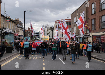 High Wycombe, Buckinghamshire, UK. 9th April 2016. EDL supporters marching on a High Wycombe street. An English Defence League demonstration has passed without major incident, the group marched from the High Wycombe train station and was escorted by a large number of Police to the town centre. There was also a large counter-protest. Three people were arrested on suspicion of public order offences and one person was arrested on suspicion of criminal damage. Credit:  Peter Manning/Alamy Live News Stock Photo