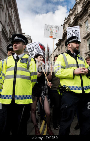 London, UK. 09th April 2016. Metropolitan police officers guarding the entrance to the Downing Street 10 while hundreds of protesters gather to call for British Prime Minister David Cameron to resign after the Panama Papers scandal. Credit:  ZEN - Zaneta Razaite / Alamy Live News Stock Photo