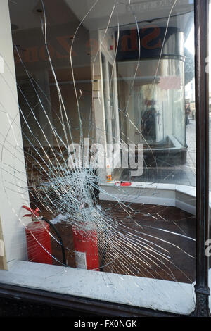 Broken glass in shop window.