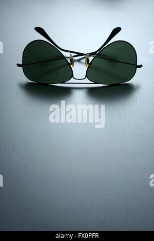 Sunglasses on a wooden table Stock Photo