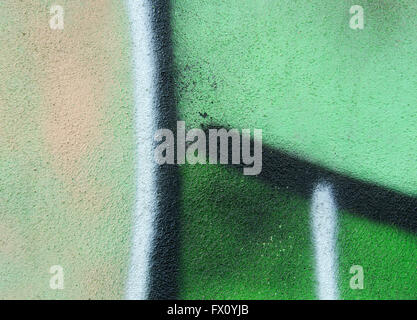 Green painted wall with black and white stripes. Stock Photo