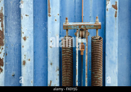 Detail of old blue rusty metal container. Stock Photo