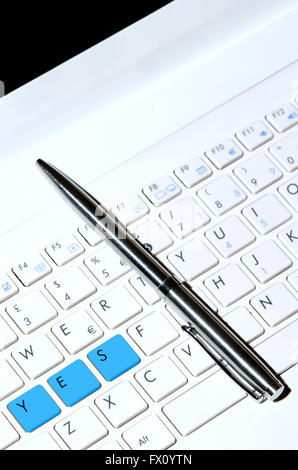 White keyboard as decision making concept and pen. Stock Photo