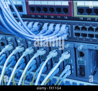 Fiber optic connecting on core network swtich Stock Photo