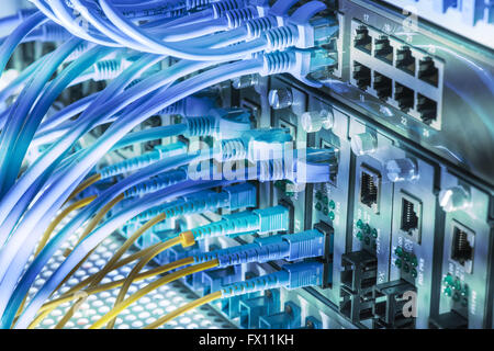 Fiber optic connecting on core network swtich Stock Photo