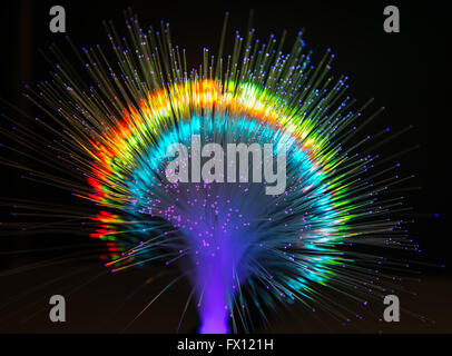 optical fibres dinamic flying from deep on technology background Stock Photo