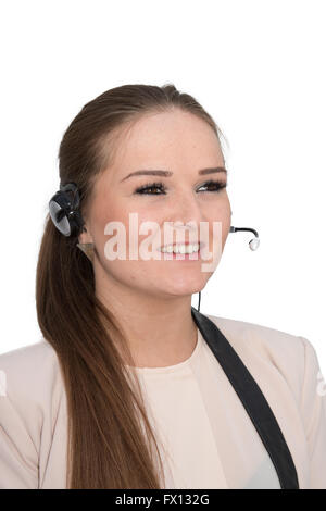 A friendly help desk employee in conversation using a head set Stock Photo