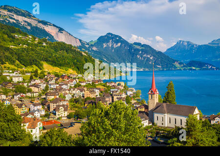 Historic town of Weggis at the northern shore of Lake Lucerne in beautiful evening light at sunset, Switzerland Stock Photo