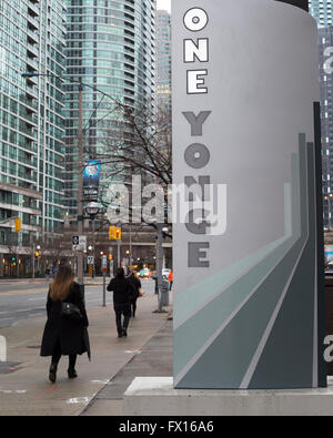 Pedestrians walking by One Yonge Street in dowtown Toronto, Ontario, Canada Stock Photo