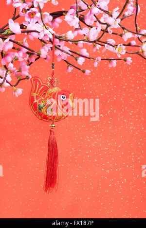 Traditional chinese knot and gold ingot mean symbols of wealth and prosperity Stock Photo