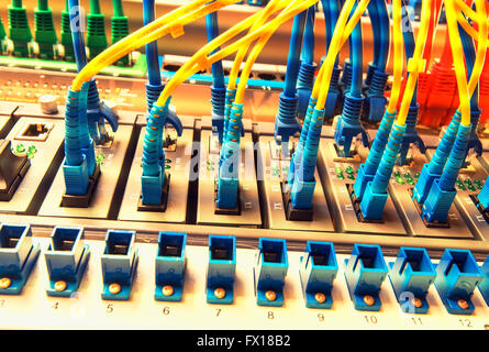 Fiber optic connecting on core network swtich Stock Photo