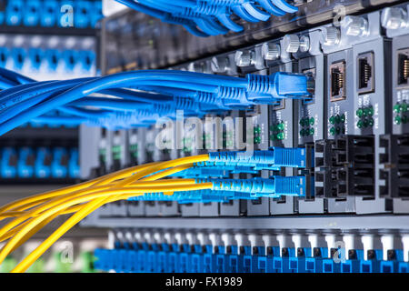 Fiber optic connecting on core network swtich Stock Photo