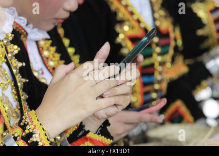 Asian woman using phone Stock Photo
