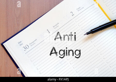 Anti aging text concept write on notebook Stock Photo